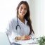 beautiful-young-female-doctor-looking-camera-office-scaled.jpg